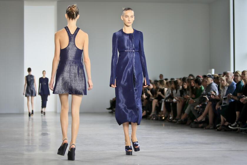 Two looks from the Calvin Klein Spring 2015 collection are shown.
