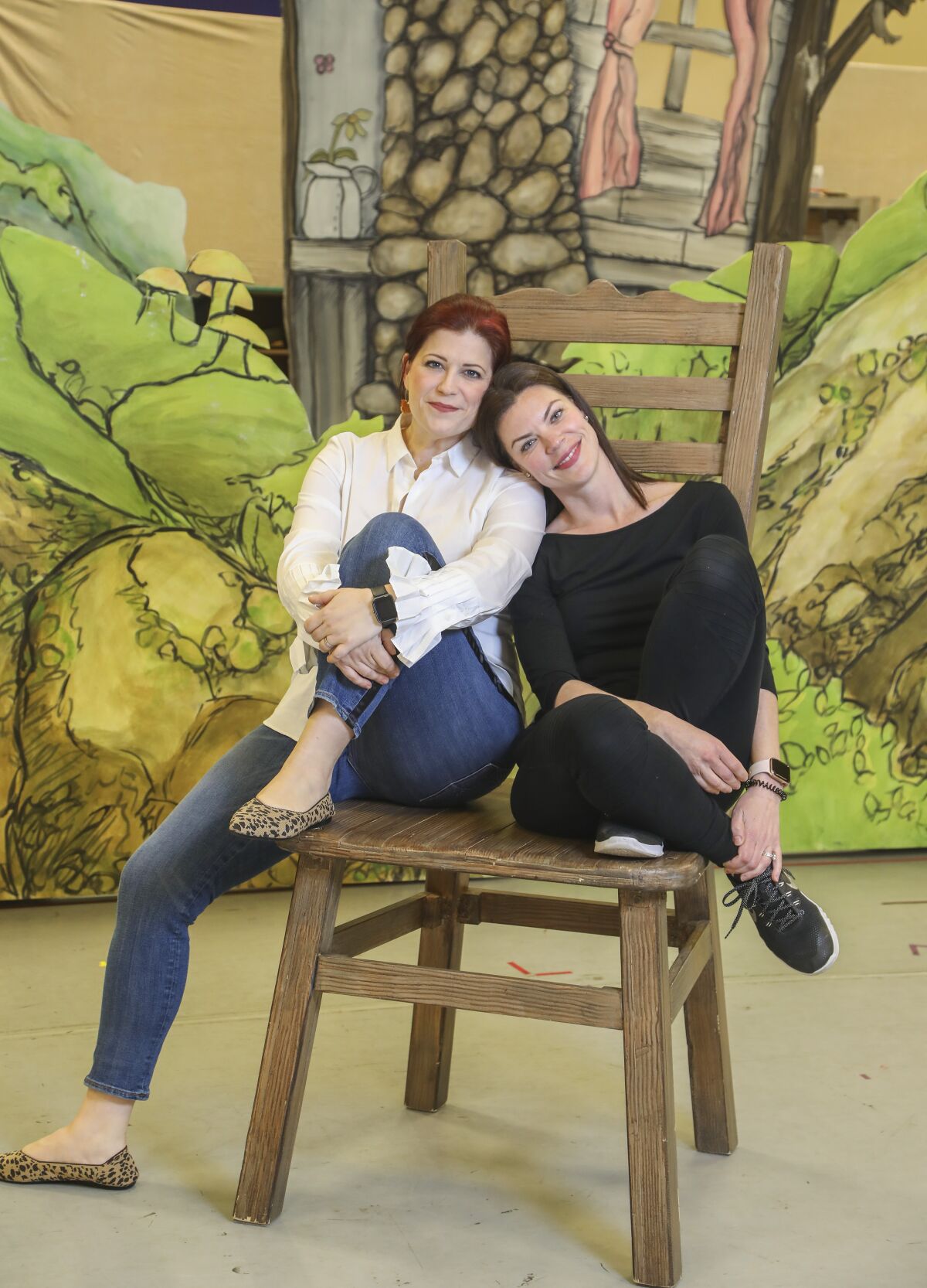 During a rehearsal of San Diego Opera's "Hansel and Gretel" cast members Blythe Gaissert, left, who plays Hansel, and Sara Gartland, right, as Gretel, pose for photos for the production that will open Feb. 8 at the San Diego Civic Theatre.