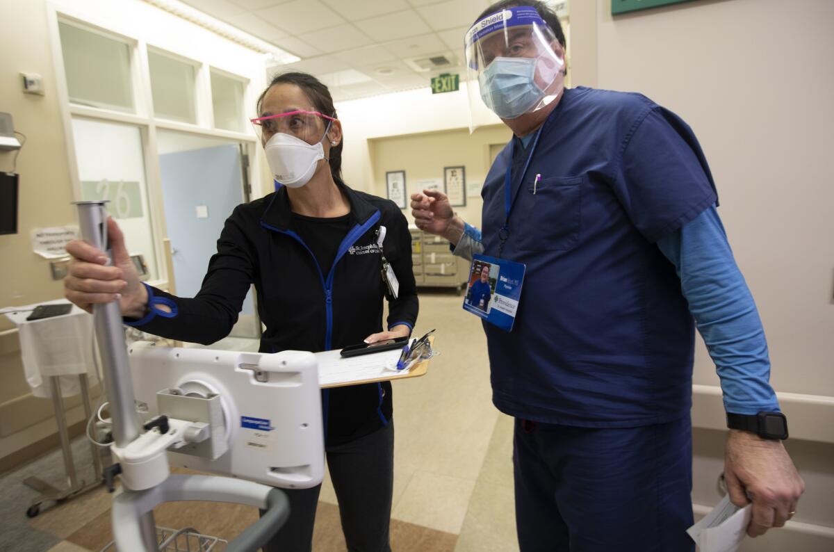 Vanessa Harper, and Dr. Brian Boyd seen in the emergency department at Providence St. Joseph Hospital in Orange, CA. 