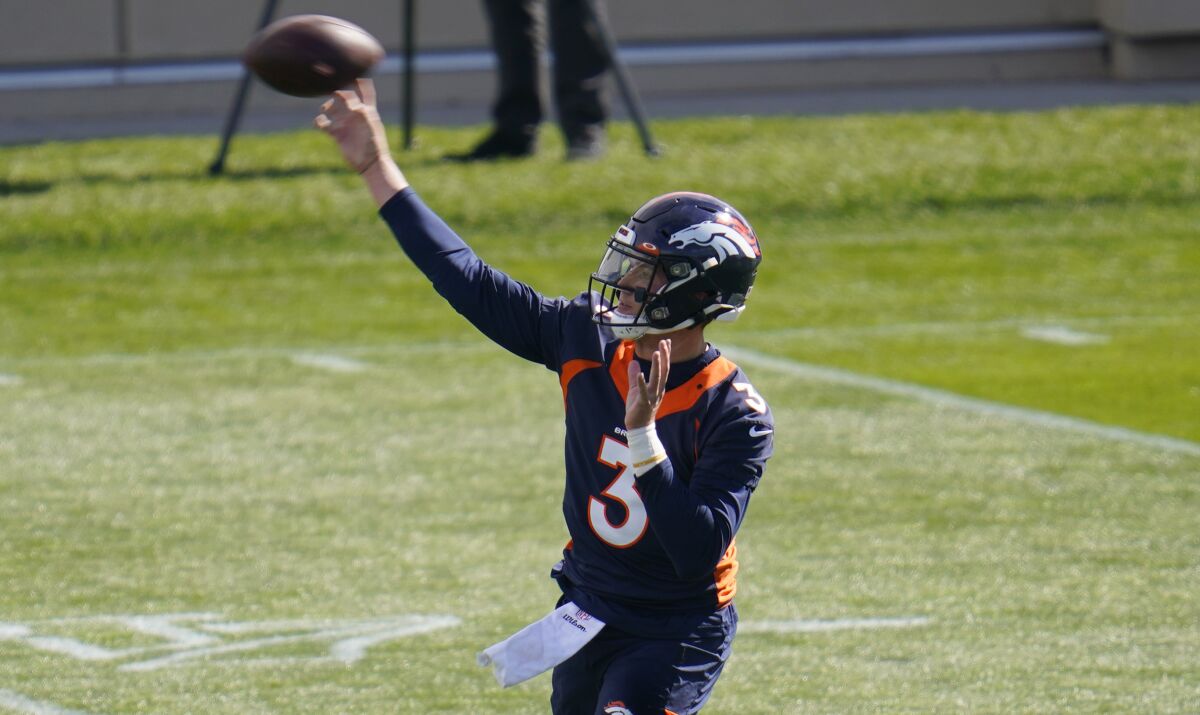 Denver Broncos quarterback Drew Lock warms up before taking part in drills during an NFL football practice Wednesday, Oct. 14, 2020, at the team's headquarters in Englewood, Colo. (AP Photo/David Zalubowski)