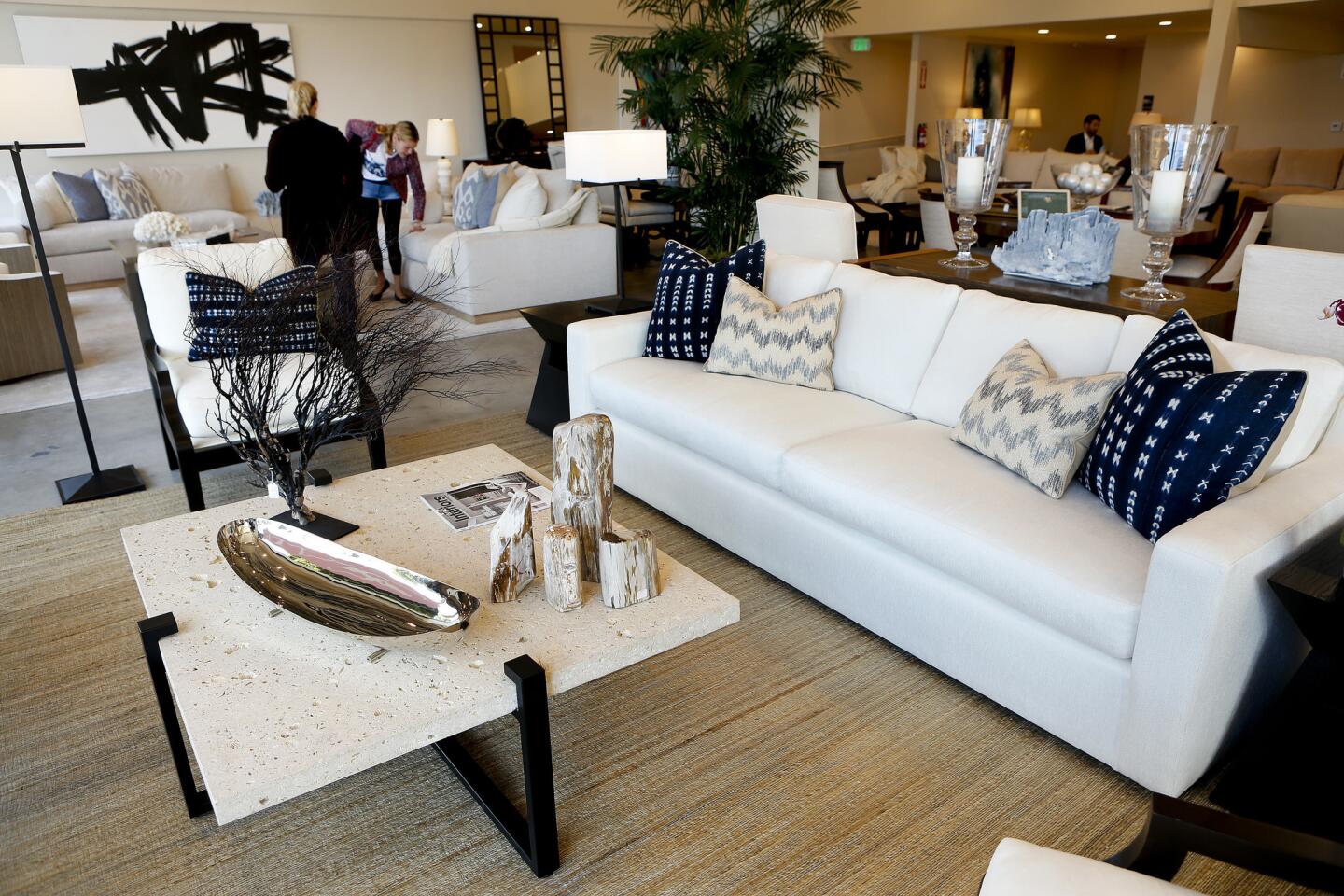 A 100% shellstone slab coffee table, left, and a transitional/contemporary larger scale sofa, right, both part of the Libra collection, are on display at Kreiss Furniture in West Hollywood.