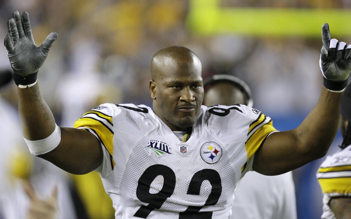 Pittsburgh linebacker James Harrison celebrates after returning an interception 100 yards for a touchdown during the second quarter of the 2009 Super Bowl.
