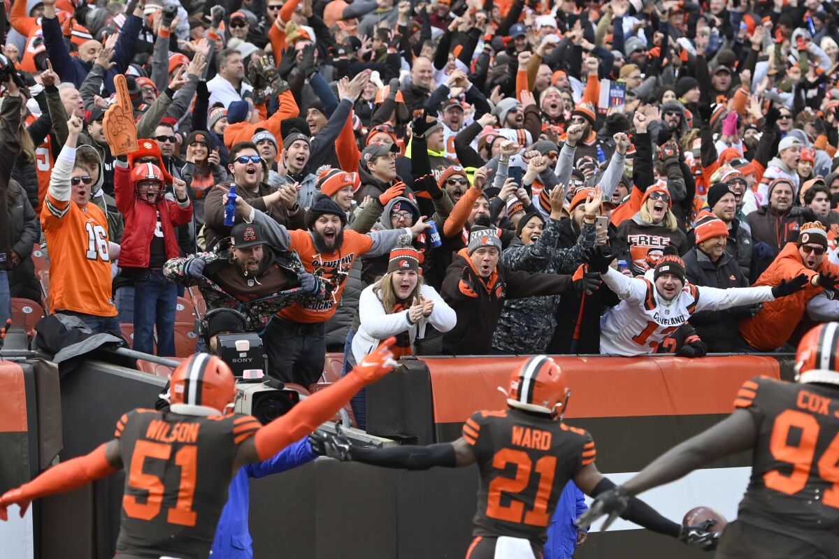 Cleveland Browns fans cheer a touchdown by cornerback Denzel Ward in 2019.
