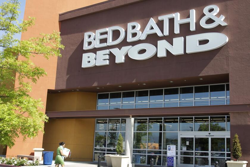 FILE - A Bed Bath & Beyond customer enters a store in Mountain View, Calif., Wednesday, May 9, 2012. Bed Bath & Beyond has filed for bankruptcy protection, but the company says its stores and websites will remain open and continue serving customers. The beleaguered home goods chain made the filing Sunday, April 23, 2023 in U.S. District Court in New Jersey, listing its estimated assets and liabilities in the range of $1 billion and $10 billion. (AP Photo/Paul Sakuma, File)