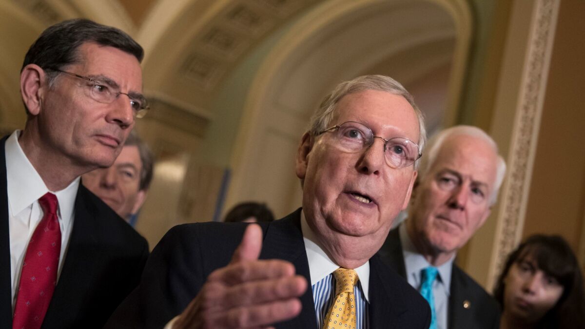 Just what are they trying to get away with? Senate Majority Leader Mitch McConnell (R-Ky.), center, flanked by Sen. John Barrasso (R-Wyo.), left, and Majority Whip John Cornyn (R-Texas), fellow members of the GOP committee writing an Obamacare repeal bill in secret.