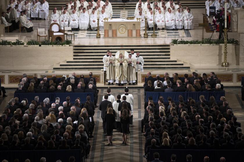 The Rev. Paul Scalia, front center, leads the funeral mass for his father, Justice Antonin Scalia, at the Basilica of the National Shrine of the Immaculate Conception in Washington on Feb. 20, 2016.