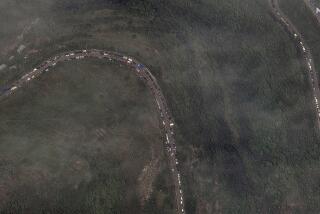 This image provided by Maxar Technologies, shows a long traffic jam of vehicles along the Lachin corridor in the Nagorno-Karabakh region on Tuesday, Sept. 26, 2023. Thousands of Armenians have streamed out of Nagorno-Karabakh after the Azerbaijani military reclaimed full control of the breakaway region last week.(Satellite image ©2023 Maxar Technologies via AP)