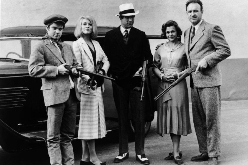 Portrait of the outlaw 'Barrow gang' holding their weapons from the movie , 'Bonnie And Clyde,' directed by Robert Benton, 1967. L-R: Michael J. Pollard, Faye Dunaway, Warren Beatty, Estelle Parsons and Gene Hackman. (Courtesy of Getty Images)