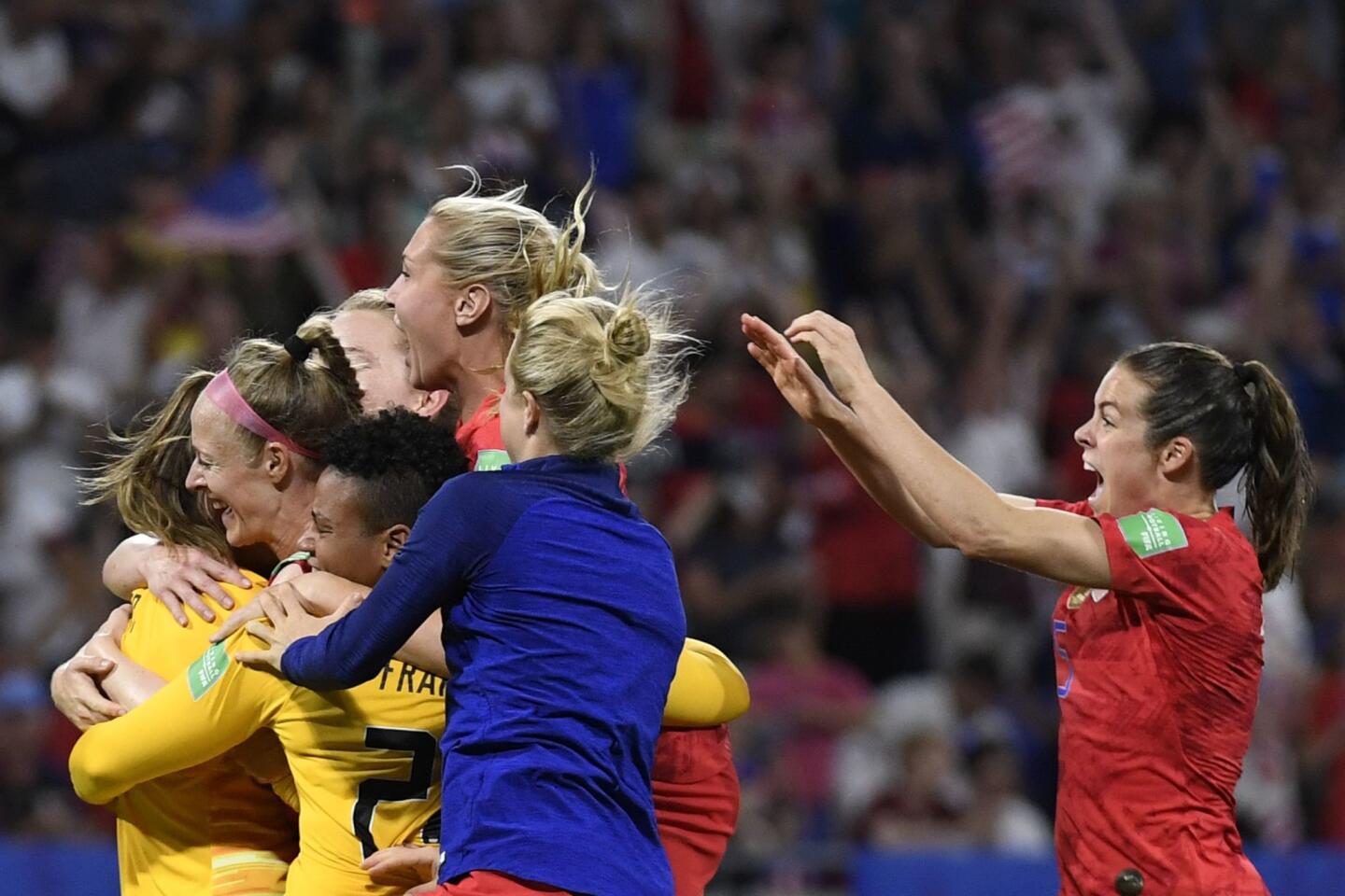 U.S. players celebrate at the end of the France 2019 Women's World Cup semi-final football match between England and USA.