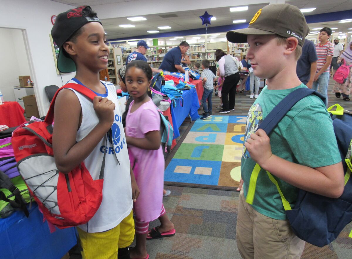 Local kids got new donated backpacks that were filled with back-to-school items last summer at the Santee Library.