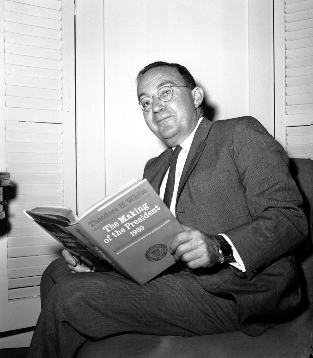 Theodore H. White poses in his New York City apartment with "The Making of a President, 1960."