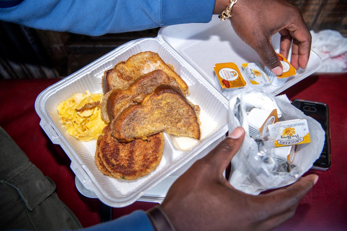 French toast and salmon croquettes in a styrofoam box