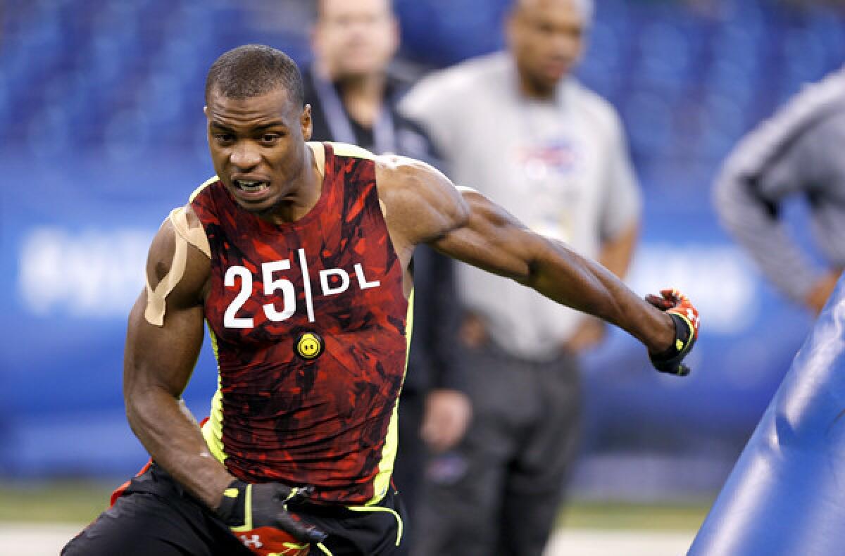 Oregon defensive end Dion Jordan goes through a drill during the NFL combine.