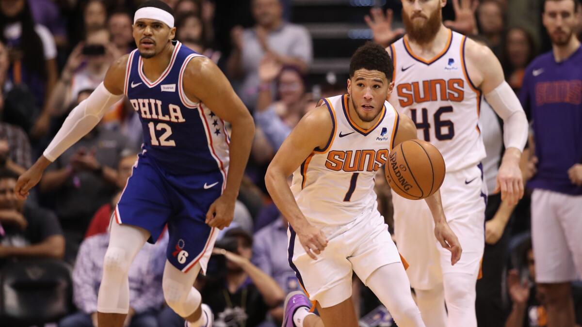 Download Phoenix Suns' Devin Booker Showing Off His New iPhone