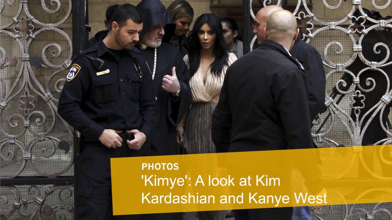 Kim Kardashian walks inside Armenian St. James Cathedral in Jerusalem with husband Kanye West, their daughter, North, and sister Khloe Kardashian.