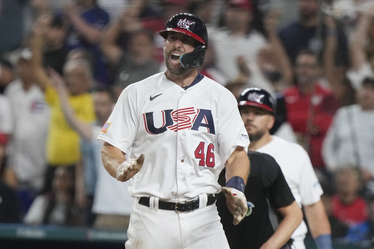 U.S. 's Paul Goldschmidt (46) gestures after scoring on a hit by Nolan Arenado during the fourth inning of a World Baseball Classic game against Cuba, Sunday, March 19, 2023, in Miami. (AP Photo/Marta Lavandier)