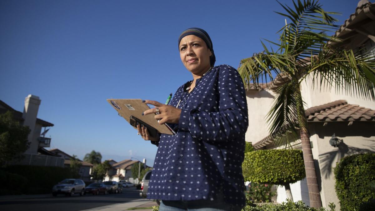 City Council candidate Fauzia Rizvi campaigns door-to-door in a Corona neighborhood.