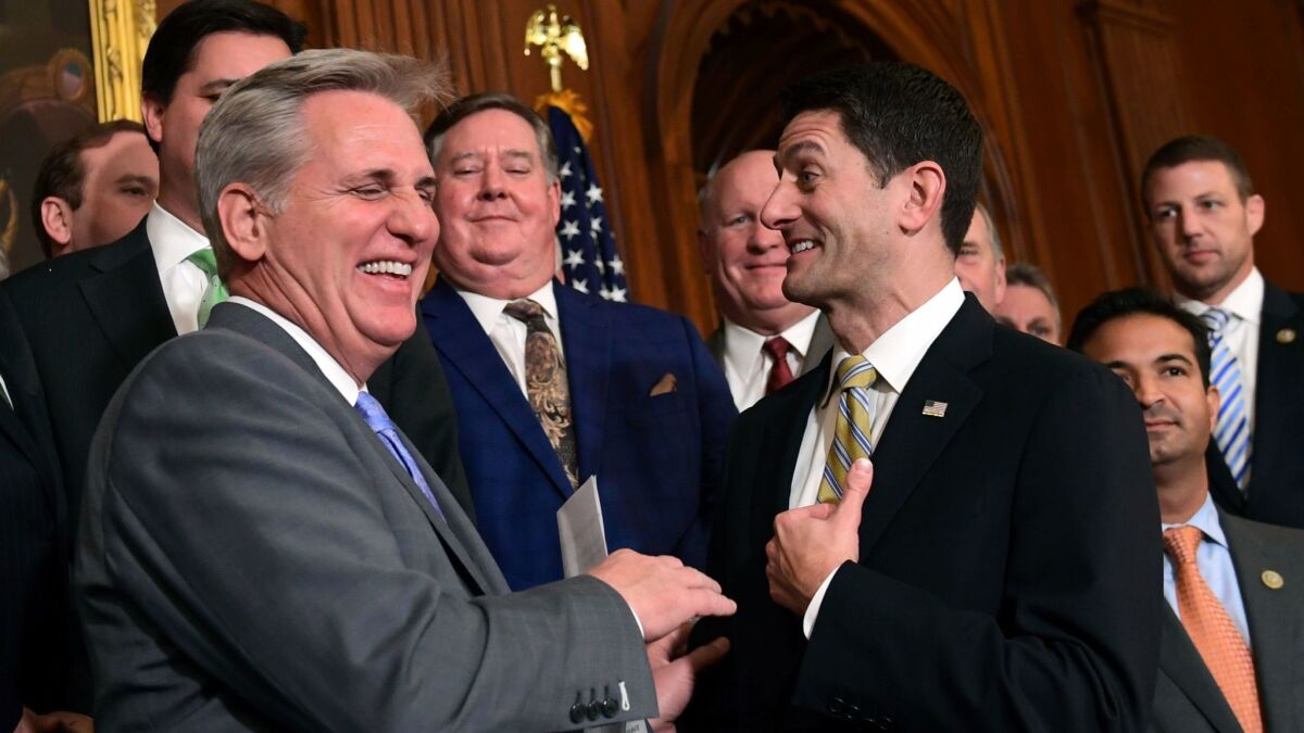House Majority Leader Kevin McCarthy, (R-Bakersfield) and Speaker Paul Ryan (R-Wis.) congratulate each other last week on passing a tax bill that cuts taxes on the rich at the expense of the middle- and working-class.