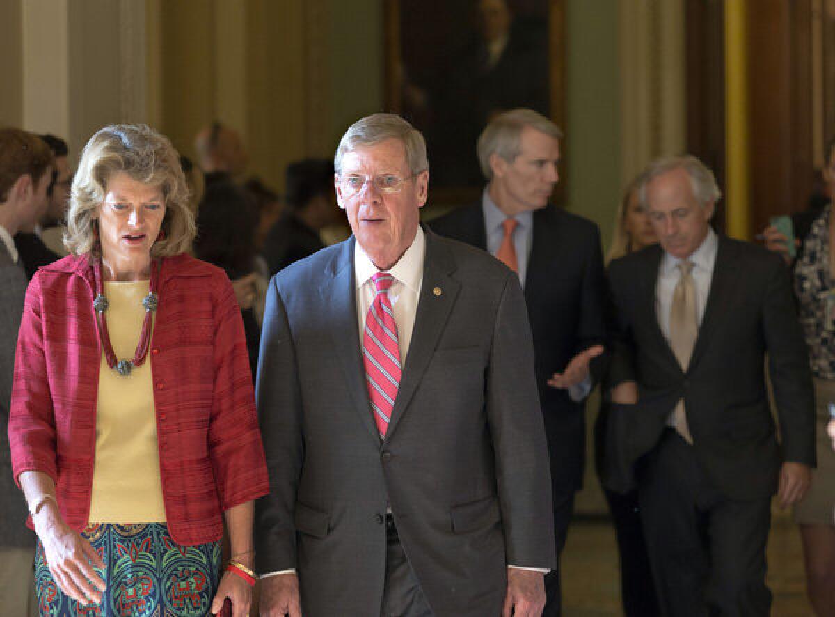 Sen. Lisa Murkowski (R-Alaska) and other senators walk to a closed-door meeting July 15 in the Old Senate Chamber to discuss a showdown over presidential nominees and filibuster rules.