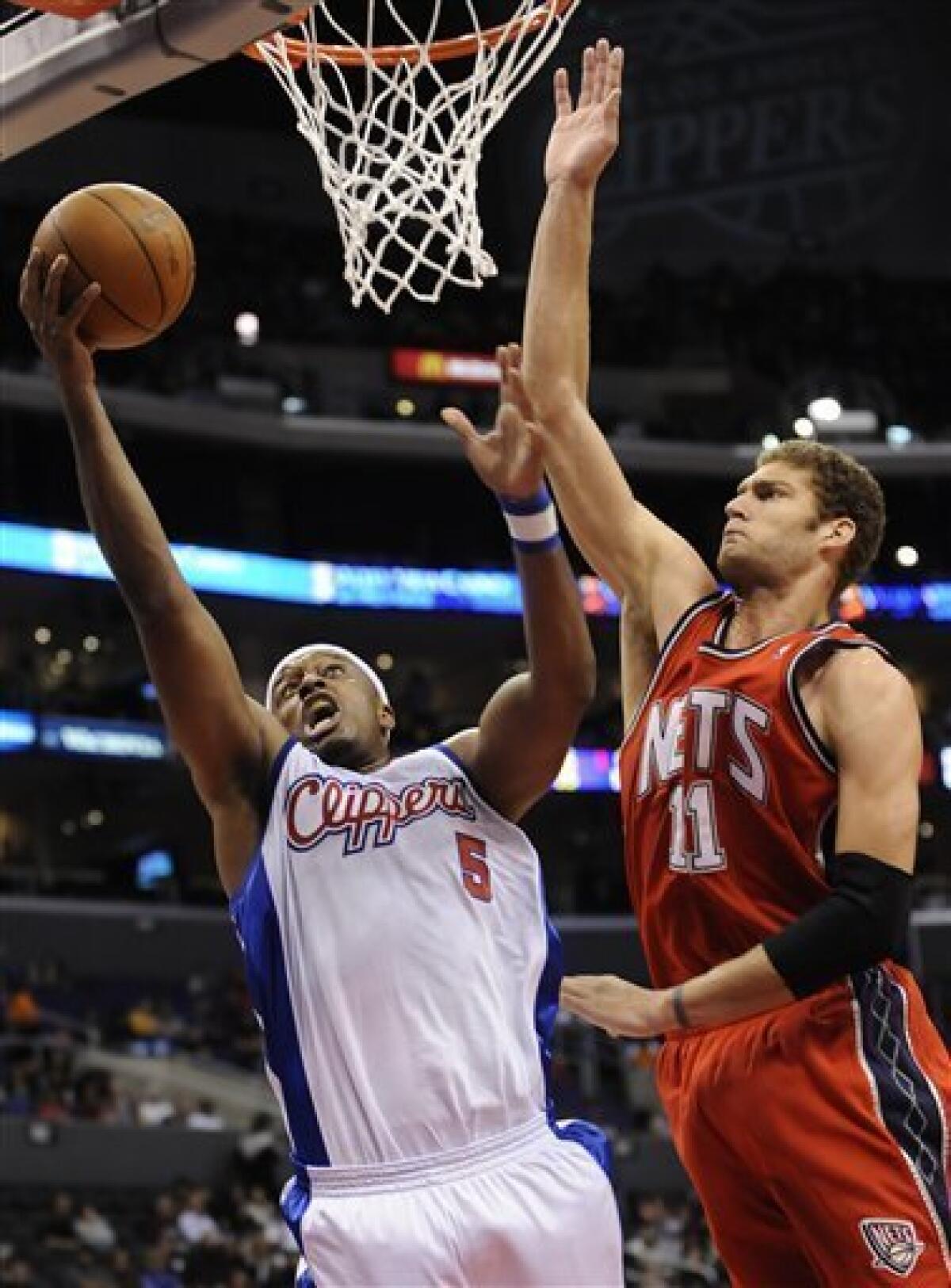 Yi Jianlian and Brook Lopez of the New Jersey Nets look on during