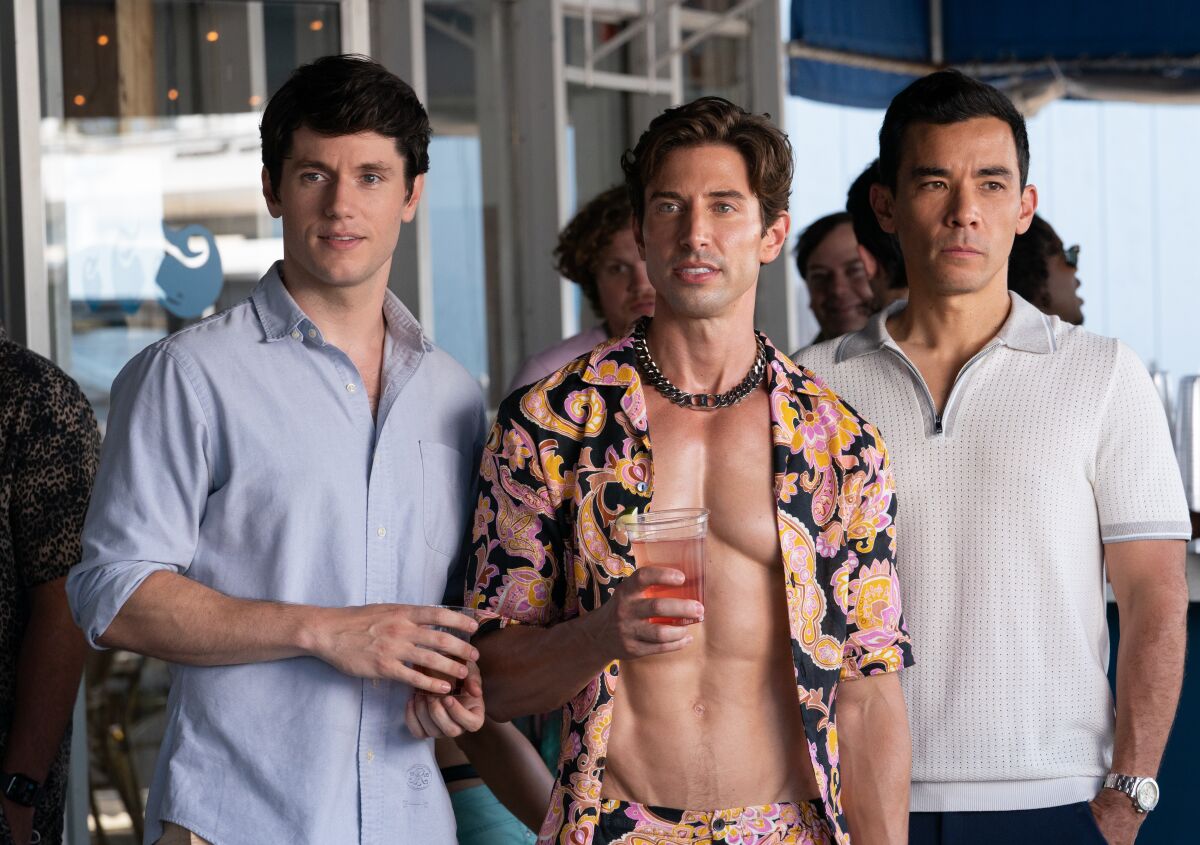 Three men hanging out at a party.