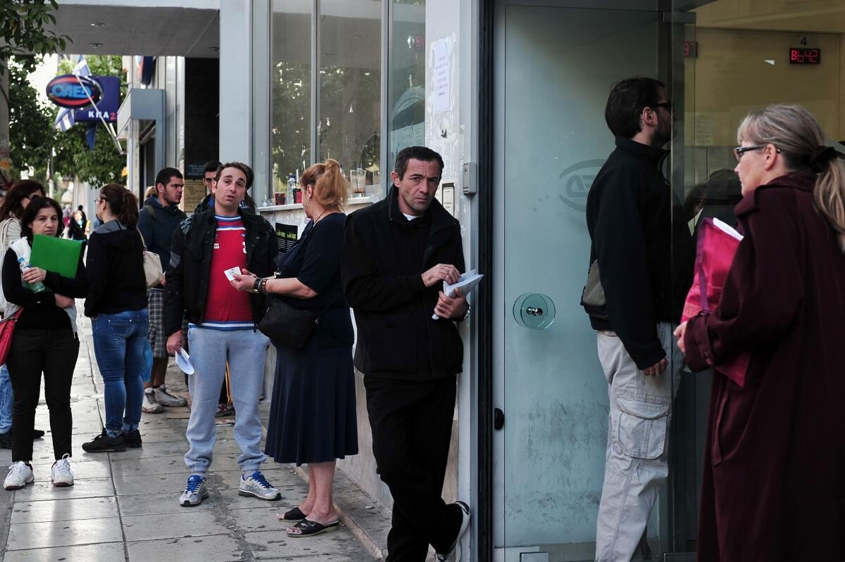 Job seekers line up outside an employment office in Athens. Global unemployment climbed to 202 million in 2013 as countries fail to keep pace with growth in the labor force, the International Labour Organization said.