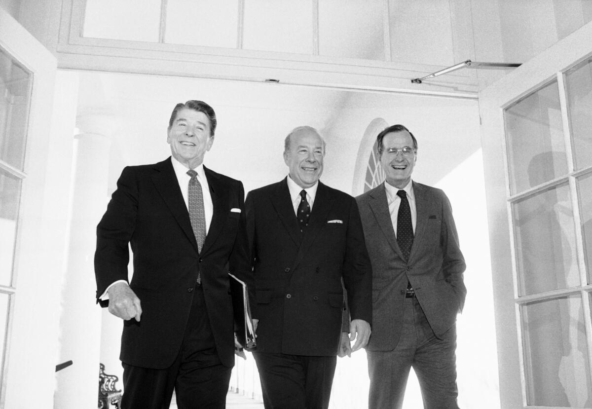 President Ronald Reagan with Secretary of State George Shultz and Vice President George H.W. Bush