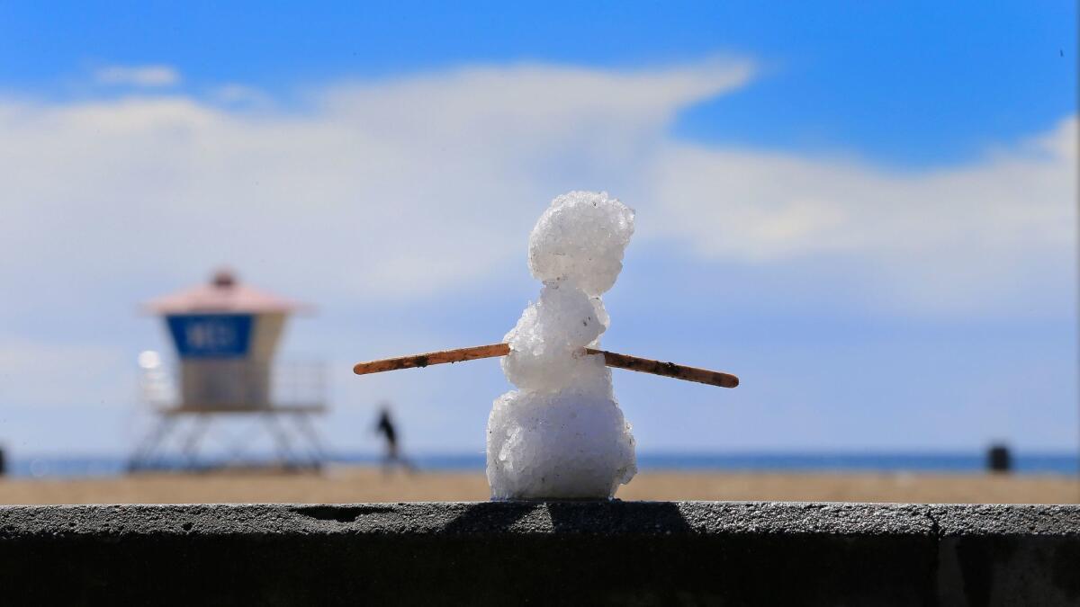 Hailstones were used to make a miniature snowman of sorts in Huntington Beach on March 2, 2015.