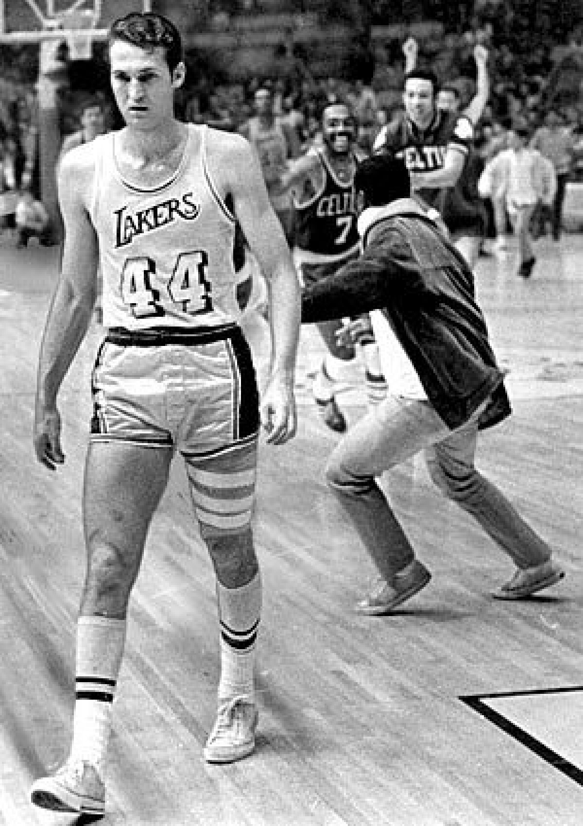 Jerry West walks off the court after a loss in Game 7 of the 1969 NBA Finals.