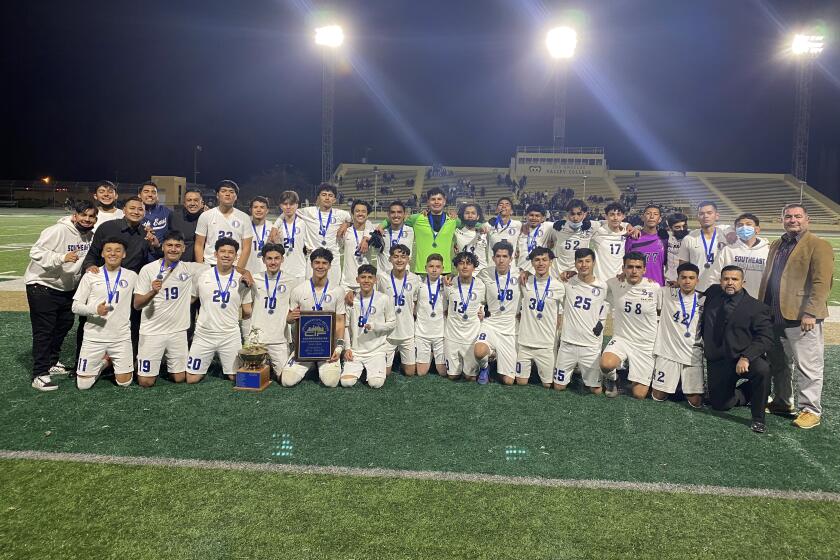 South East celebrates City Section Division I soccer title with 2-1 win over Birmingham in overtime.