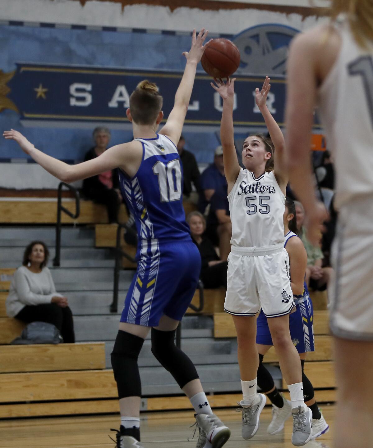 Newport Harbor's Emma Fults (55) shoots against Fountain Valley's Zoe Ziegler (10) during the first half in a Wave League game on Saturday.