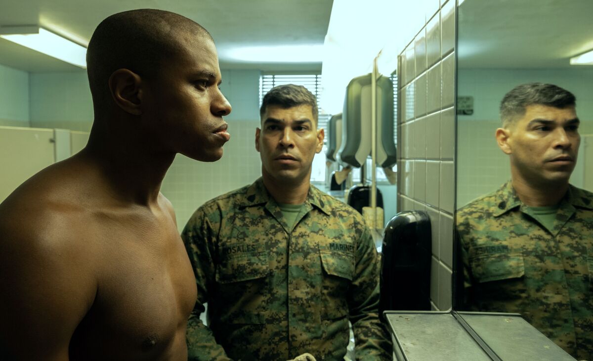 A drill sergeant stares down a Marine in a military bathroom.