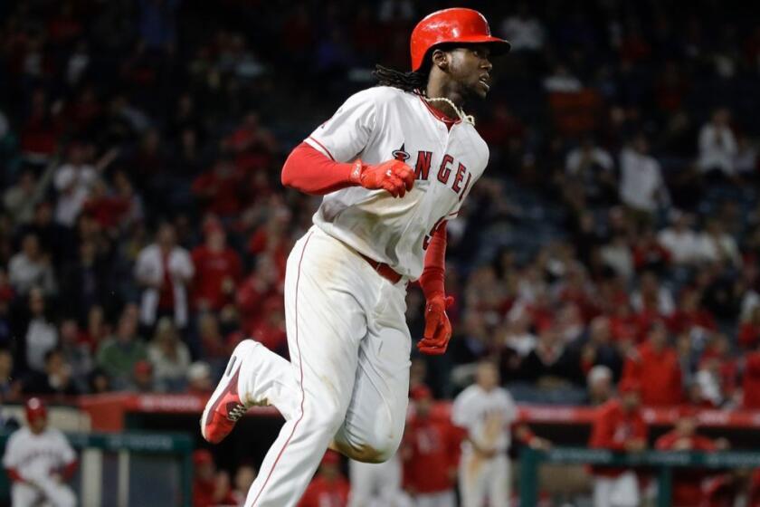 Los Angeles Angels' Cameron Maybin runs to first base after hitting a RBI single during the seventh inning of a baseball game against the Oakland Athletics, Wednesday, April 26, 2017, in Anaheim, Calif. (AP Photo/Jae C. Hong)