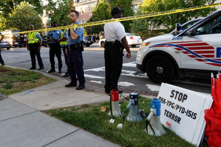 Police secure the street outside the Turkish embassy after Turkish leader Recep Tayyip Erdogan's security detail clashed with pro-Kurdish protesters in Washington, D.C. on May 16.
