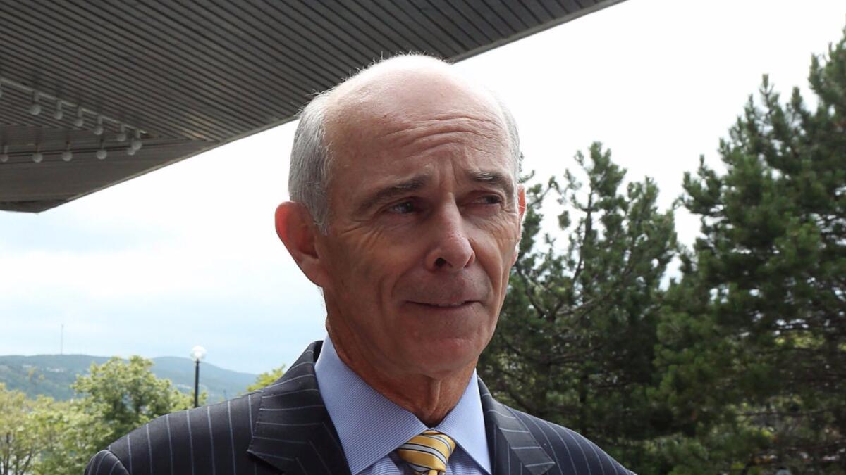 In this 2015 photo, Tom May, then-president and CEO of Eversource Energy, take questions at the annual Conference of New England Governors and Eastern Canadian Premiers in St. John's, Newfoundland,.