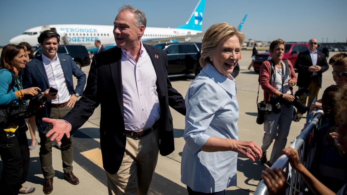 Democratic presidential nominee Hillary Clinton and her running mate Tim Kaine arrive for a Cleveland campaign stop.