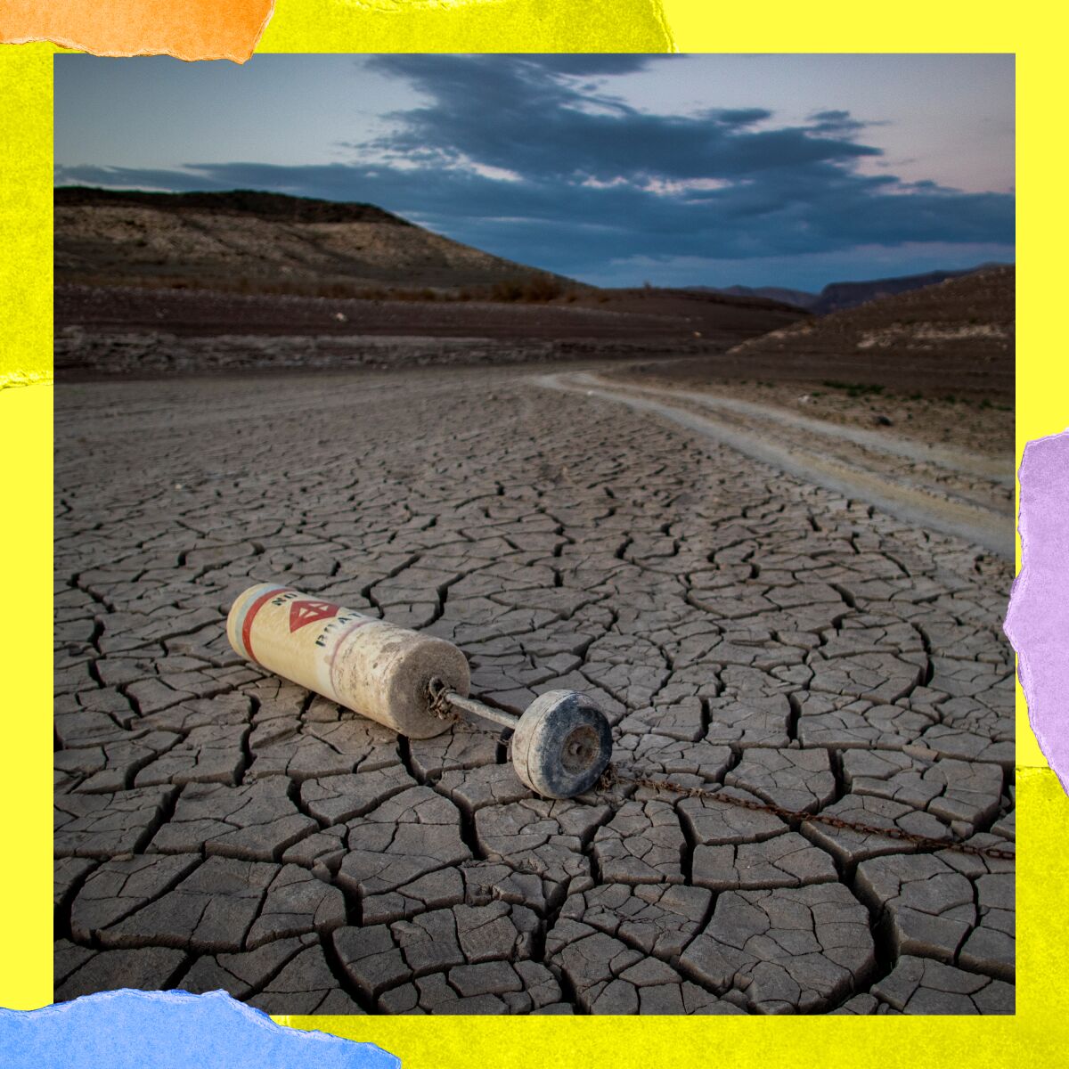 A buoy lies on a dried mud flat at a closed marina at drought-stricken Lake Mead on July 12 near Las Vegas.