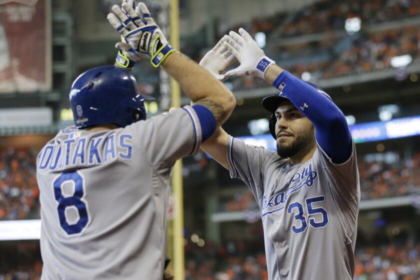 Kansas City first baseman Eric Hosmer (35) celebrates with third baseman Mike Moustakas (8) after his two-run home run in the ninth inning during Game 4 of the ALDS.