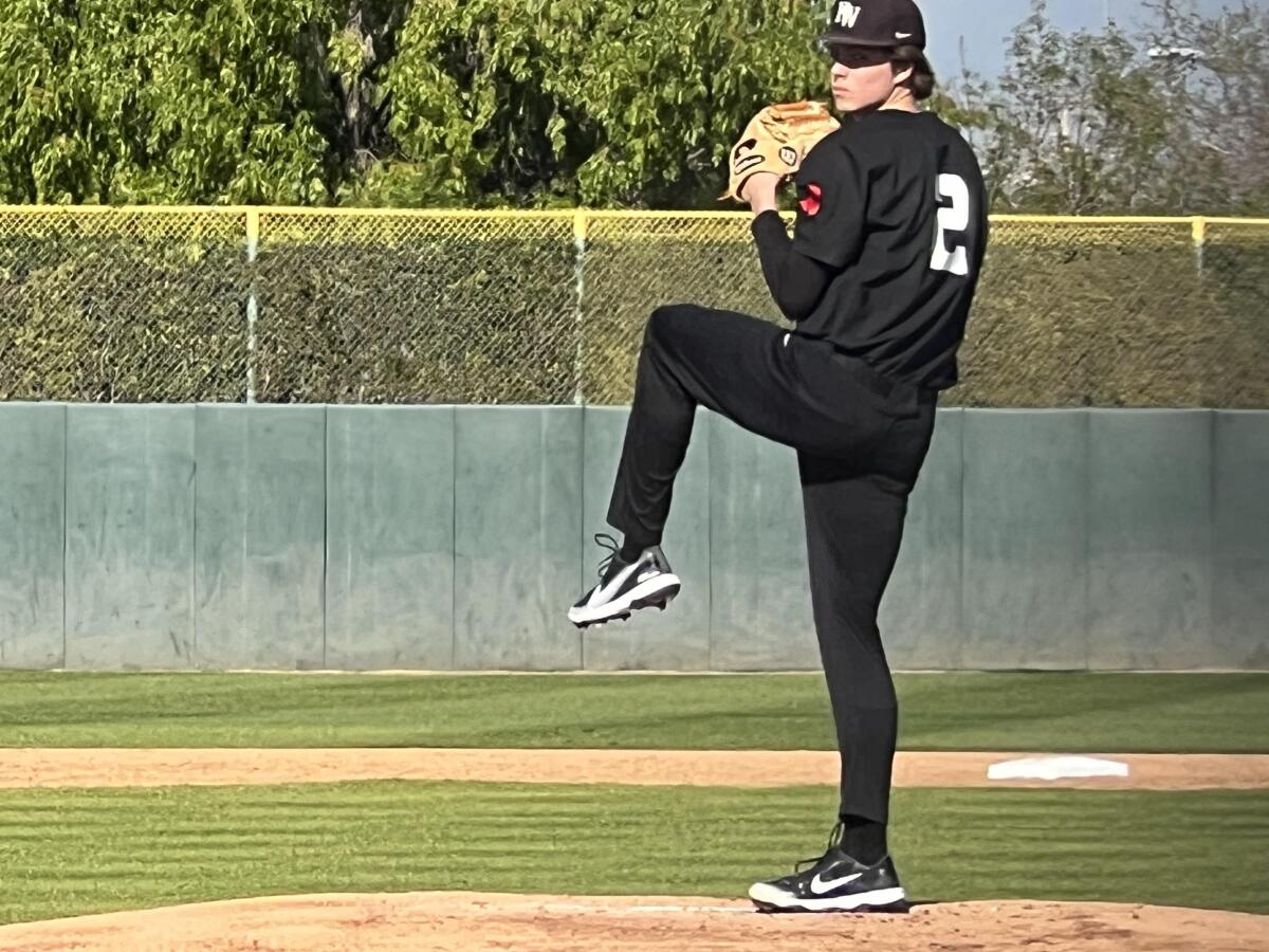 Bryce Rainer of Harvard-Westlake winds up to deliver a pitch.