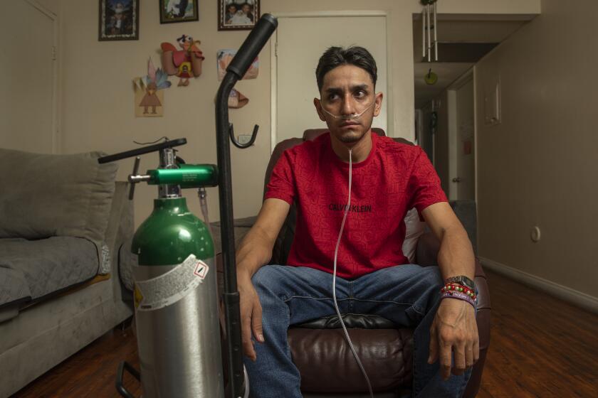 PACOIMA, CA-SEPTEMBER 8, 2023: Leobardo Segura Meza, 27, who suffers from silicosis, an incurable lung disease that has been afflicting workers who cut and polish engineered stone high in silica, is photographed at his home in Pacoima. (Mel Melcon / Los Angeles Times)