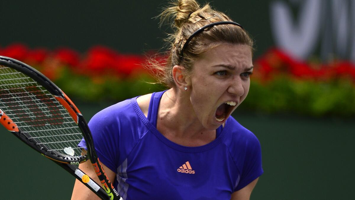 Simona Halep celebrates during her victory over Jelena Jankovic in the BNP Paribas Open women's final at Indian Wells on Sunday.