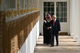 President Trump and Crown Prince Mohammed bin Salman of Saudi Arabia walk together.