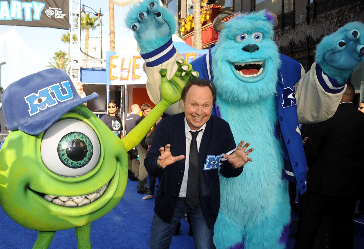 Billy Crystal sports his alma mater's sweater at the premiere of Disney/Pixar's "Monsters University."