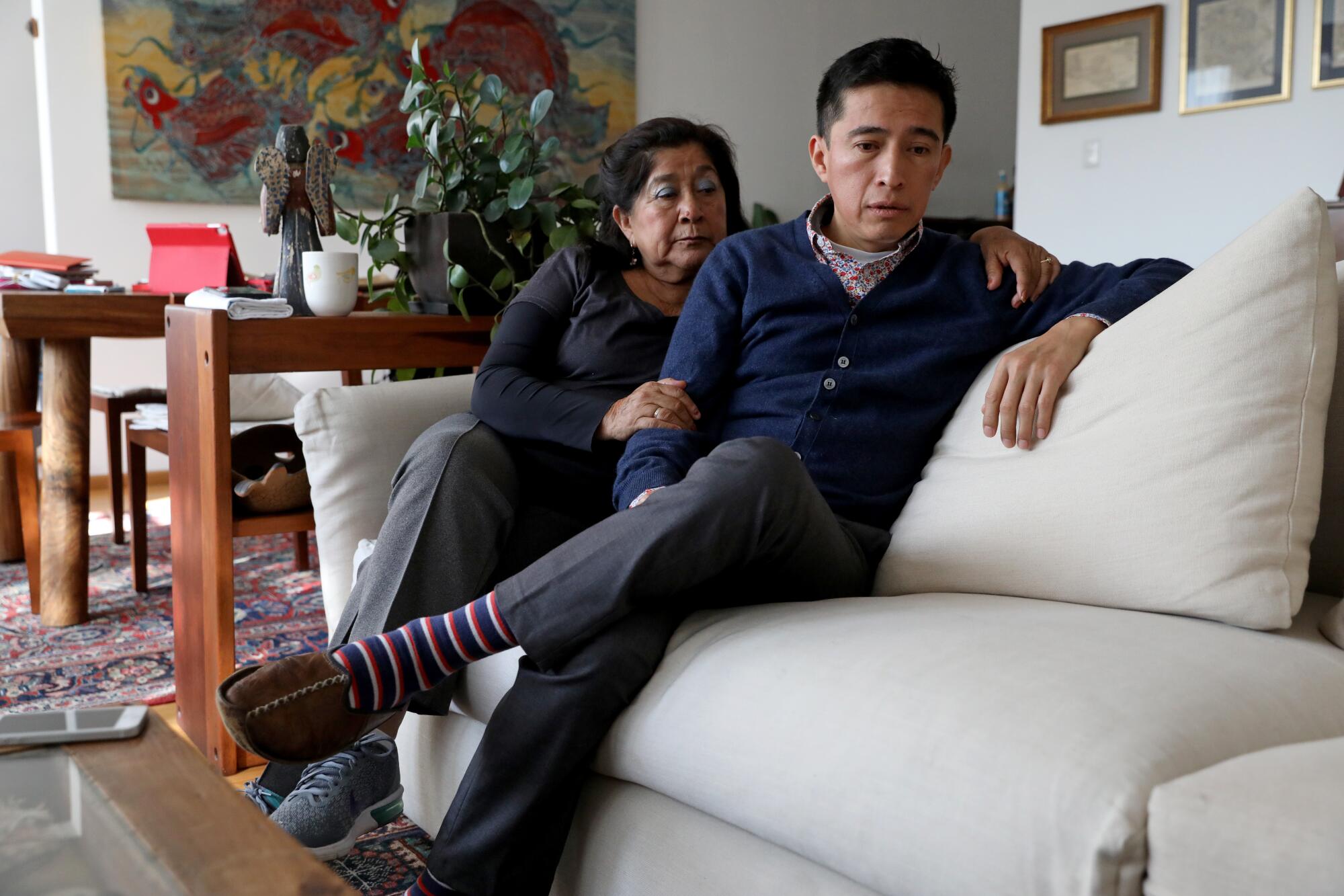 Maricela Peñaloza Flores, wife of Albino Quiroz Sandoval, with son Juan Carlos Quiroz at his apartment in Mexico City.