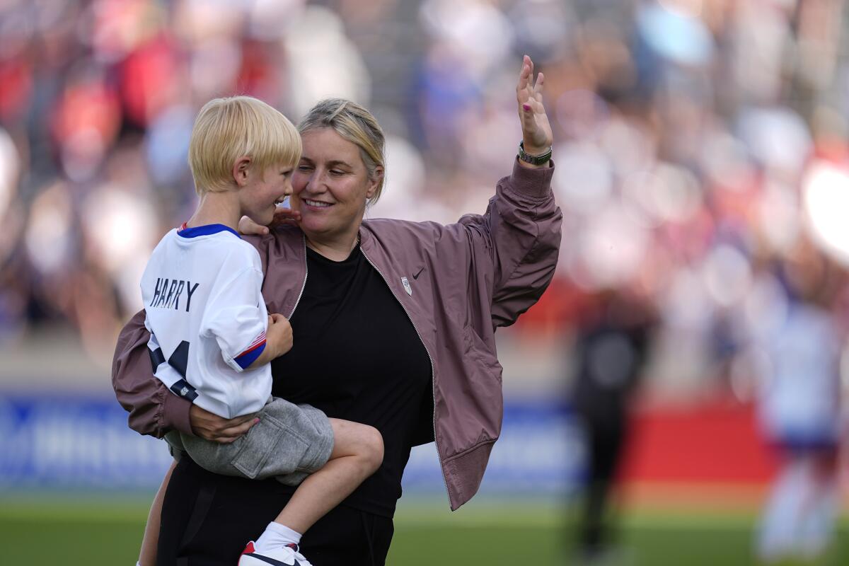 U.S. women's national soccer team coach Emma Hayes holds her 5-year-old son, Harry.