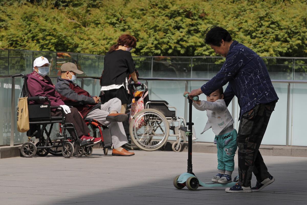 Old and young people at office compound in Beijing