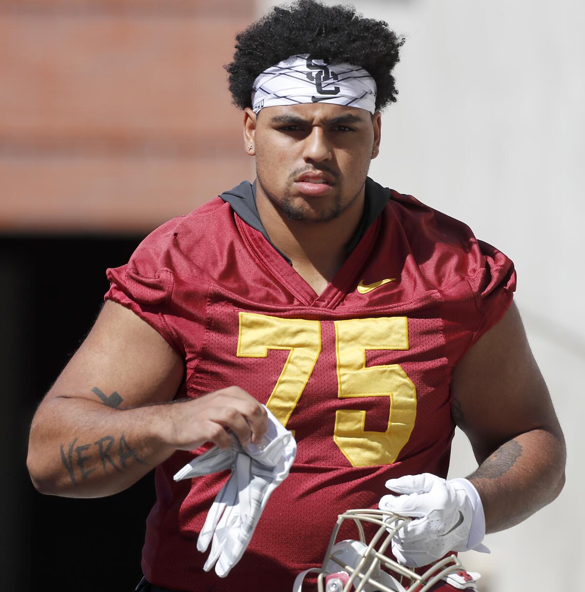 USC offensive lineman Alijah Vera-Tucker heads to the practice field during training camp last August.