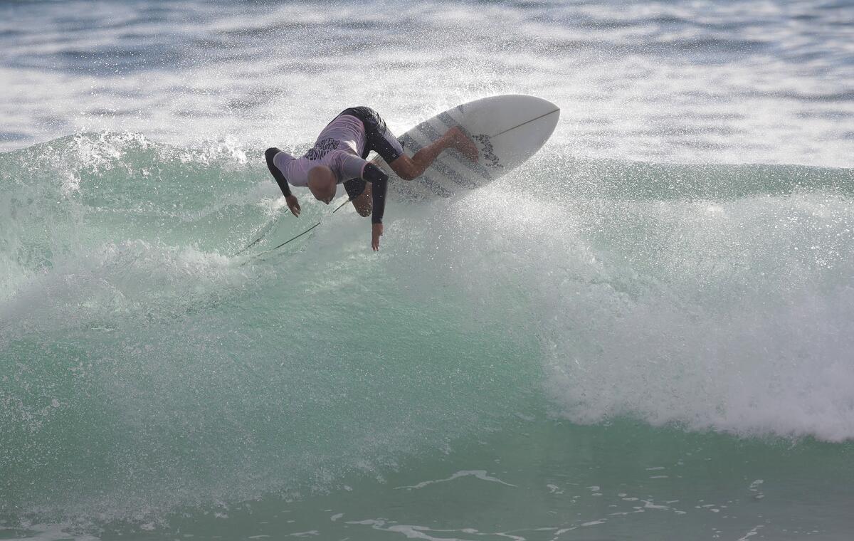 Division champion Micah Byrne climbs and goes off the top of a big section as he surfs the Sr. Masters division final.