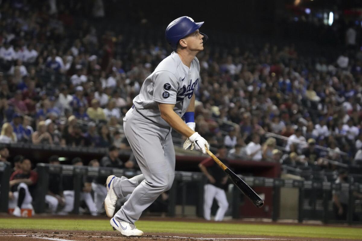 The Dodgers' Will Smith hits a two-run home run against the Diamondbacks in the first inning June 19, 2021.