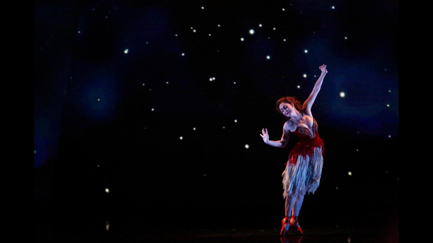 Ashley Shaw performs in choreographer Matthew Bourne's "The Red Shoes" at the Ahmanson Theatre in Los Angeles. This version of "The Red Shoes" is a mash-up of music from Hollywood films and trademark theatrical dance performances.